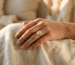 val moissanite engagement ring on a woman's hand catching natural sunlight — Revarado buying guide